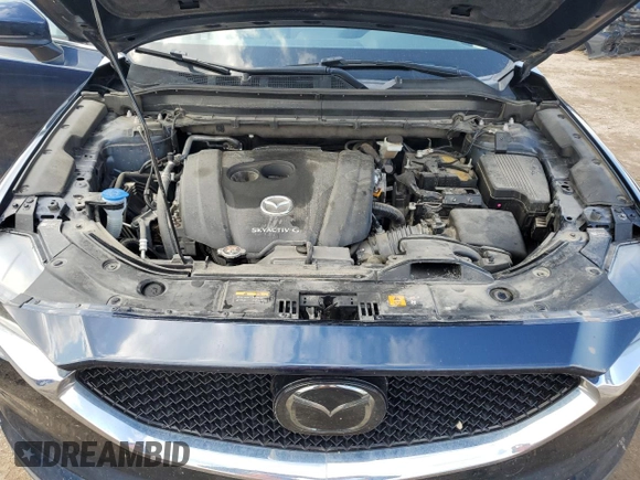 2021 Mazda CX-5 Grand Touring with VIN JM3KFBDM0M0500561, listed as a Copart auction lot 58214665 with 49,543 mi miles and Salvage title. Bid and sale history available at DreamBid. Image 12.