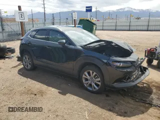 2023 Mazda CX-30 S Premium with VIN 3MVDMBDMXPM527113, listed as a Copart auction lot 57169165 with 49,040 mi miles and Salvage title. Bid and sale history available at DreamBid. Image 4.