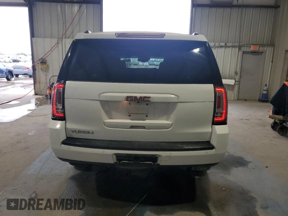 2016 GMC Yukon SLT with VIN 1GKS1BKC5GR450147, listed as a Copart auction lot 51058805 with 163,944 mi miles and Salvage Title. Bid and sale history available at carsss.com. Image 6.