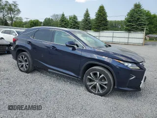 2018 Lexus RX 350 with VIN 2T2BZMCA6JC149235, listed as a Copart auction lot 59939505 with 214,676 mi miles and Salvage title. Bid and sale history available at DreamBid. Image 4.