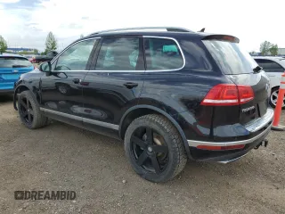 2015 Volkswagen Touareg Sport z VIN WVGEF9BP3FD004771, wystawiony jako Copart lot #58668125 z przebiegiem 64 422 mil mil oraz Czysty tytuł • Clean title. Historia ofert i sprzedaży dostępna na DreamBid. Obrazek 2.