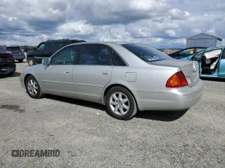 2000 Toyota Avalon XL with VIN 4T1BF28B3YU002835, listed as a Copart auction lot 50902115 with 128,699 mi miles and Salvage Title. Bid and sale history available at DreamBid. Image 2.