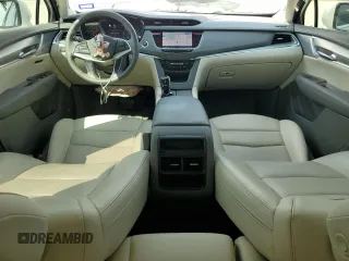 2023 Cadillac XT5 FWD Premium Luxury with VIN 1GYKNCRS7PZ150378, listed as a Copart auction lot 71792184 with 21,631 mi miles and Salvage Title. Bid and sale history available at carsss.com. Image 8.