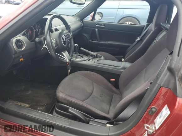 2011 Mazda MX-5 Miata Club with VIN JM1NC2MF0B0213167, listed as a Copart auction lot 57776875 with 77,694 mi miles and Salvage title. Bid and sale history available at DreamBid. Image 7.
