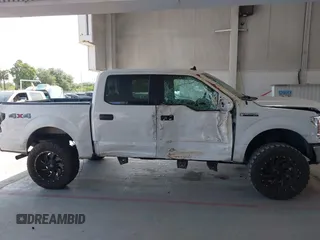 2019 Ford F-150 XL with VIN 1FTEW1E55KFB69767, listed as a IAAI auction lot 42326370 with 143,523 mi miles and . Bid and sale history available at DreamBid. Image 13.