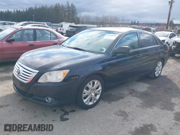 2010 Toyota Avalon XL with VIN 4T1BK3DB1AU356186, listed as a IAAI auction lot 41704838 with 150,462 mi miles and . Bid and sale history available at carsss.com. Image 2.