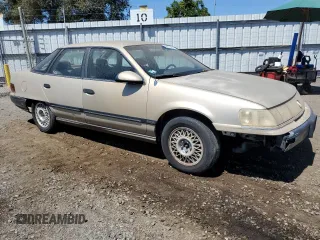 1990 Mercury Sable z VIN 1MECM50U6LG650642, wystawiony jako Copart lot #68279364 z przebiegiem 77 204 mil mil oraz Tytuł czysty. Historia ofert i sprzedaży dostępna na DreamBid. Obrazek 4.