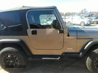 2003 Jeep Wrangler Sport with VIN 1J4FA49S53P365363, listed as a IAAI auction lot 41818320 with 154,567 mi miles. Bid and sale history available at carsss.com. Image 13.