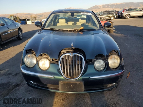 2003 Jaguar S-Type z VIN SAJEA01U73HM48330, wystawiony jako Copart lot #80128574 z przebiegiem Nie podano mil oraz Szkody całkowita. Historia ofert i sprzedaży dostępna na DreamBid. Obrazek 5.
