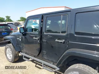 2015 Jeep Wrangler Unlimited Sahara with VIN 1C4BJWEG0FL717536, listed as a IAAI auction lot 42004096 with 90,802 mi miles and . Bid and sale history available at DreamBid. Image 14.