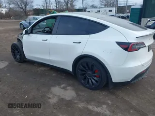 2021 Tesla Model Y Performance with VIN 5YJYGDEF1MF262930, listed as a IAAI auction lot 41606321 with 28,882 mi miles and . Bid and sale history available at DreamBid. Image 3.
