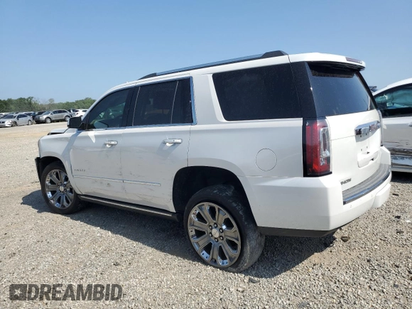 2016 GMC Yukon Denali with VIN 1GKS1CKJ7GR264548, listed as a Copart auction lot 62982234 with 105,724 mi miles and Salvage Title. Bid and sale history available at carsss.com. Image 2.