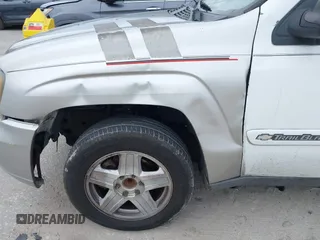2003 Chevrolet TrailBlazer EXT LT with VIN 1GNES16S736235213, listed as a IAAI auction lot 41237480 with 297,434 mi miles and . Bid and sale history available at DreamBid. Image 6.