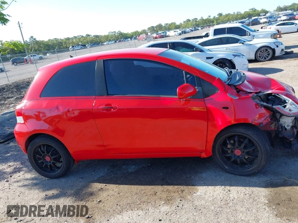 2009 Toyota Yaris with VIN JTDJT903695234623, listed as a IAAI auction lot 42027852 with 146,000 mi miles. Bid and sale history available at carsss.com. Image 13.