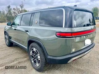 2023 Rivian R1S Launch Edition with VIN 7PDSGABL2PN003733, listed as a Copart auction lot 56033315 with 9,996 mi miles and Salvage Title. Bid and sale history available at carsss.com. Image 3.