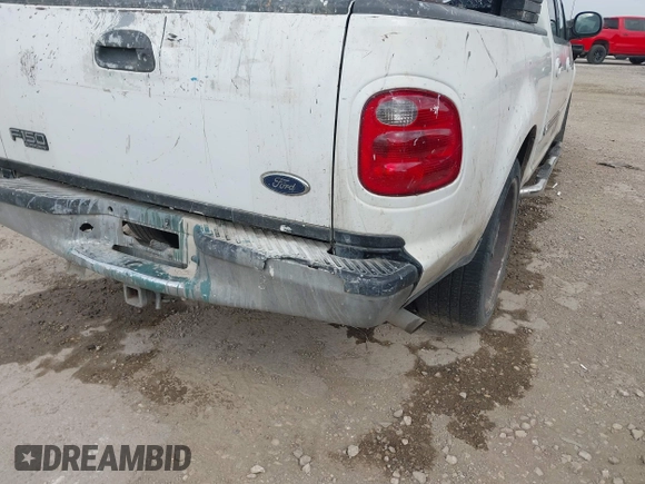 2002 Ford F-150 XLT with VIN 1FTRW07602KB74836, listed as a IAAI auction lot 42069307 with 295,692 mi miles. Bid and sale history available at carsss.com. Image 6.
