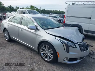 2019 Cadillac XTS Luxury z VIN 2G61M5S30K9150828, wystawiony jako IAAI lot #42401634 z przebiegiem 95 806 mil mil oraz . Historia ofert i sprzedaży dostępna na DreamBid. Obrazek 1.