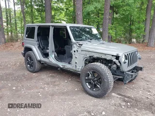 2021 Jeep Wrangler Unlimited Sahara with VIN 1C4HJXEG0MW703812, listed as a IAAI auction lot 42186089 with 50,349 mi miles and . Bid and sale history available at DreamBid. Image 1.