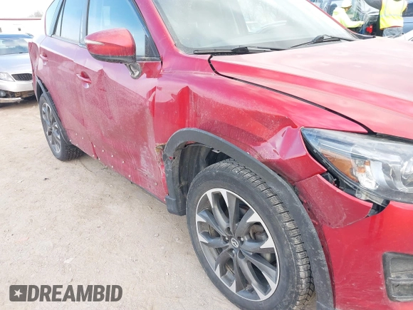 2016 Mazda CX-5 Grand Touring with VIN JM3KE4DY8G0729446, listed as a IAAI auction lot 41871207 with 89,258 mi miles. Bid and sale history available at carsss.com. Image 6.