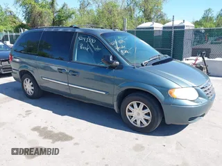 2007 Chrysler Town & Country LWB Touring with VIN 2A4GP54L47R167189, listed as a IAAI auction lot 42143590 with 165,547 mi miles. Bid and sale history available at carsss.com. Image 1.