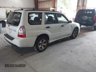 2007 Subaru Forester X with VIN JF1SG63637H736844, listed as a IAAI auction lot 40371482 with 166,328 mi miles. Bid and sale history available at carsss.com. Image 4.