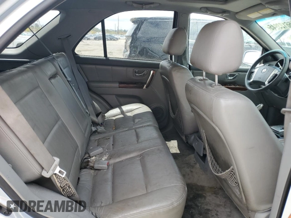 2006 Kia Sorento LX z VIN KNDJD733265572903, wystawiony jako Copart lot #56123945 z przebiegiem 185 664 mil mil oraz Szkoda całkowita • Salvage title. Historia ofert i sprzedaży dostępna na DreamBid. Obrazek 11.