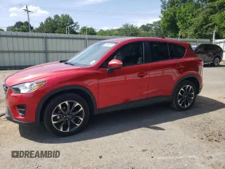 2016 Mazda CX-5 Grand Touring z VIN JM3KE2DY0G0722334, wystawiony jako Copart lot #59998185 z przebiegiem 51 449 mil mil oraz Szkoda całkowita • Salvage title. Historia ofert i sprzedaży dostępna na DreamBid. Obrazek 1.