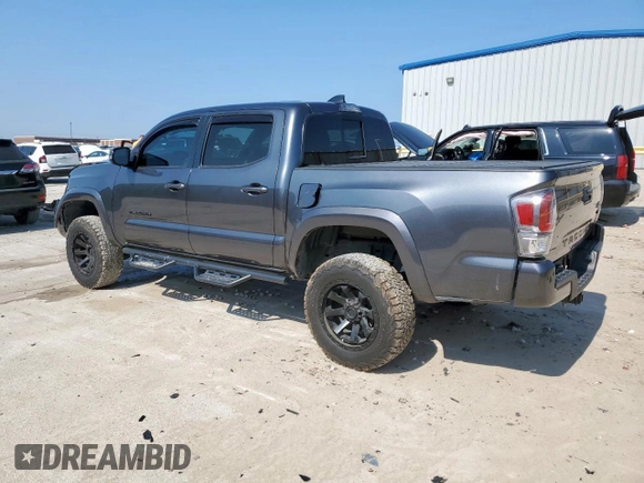 2021 Toyota Tacoma SR with VIN 3TMCZ5AN9MM451389, listed as a Copart auction lot 59191355 with 26,427 mi miles and Salvage title. Bid and sale history available at DreamBid. Image 2.