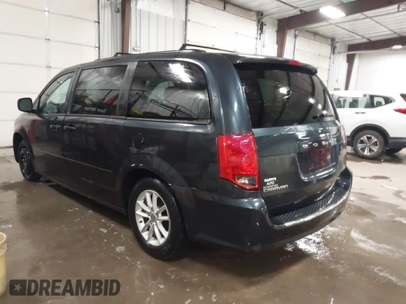 2014 Dodge Grand Caravan SXT with VIN 2C4RDGCGXER154709, listed as a IAAI auction lot 41117603 with 214,872 mi miles and . Bid and sale history available at DreamBid. Image 3.