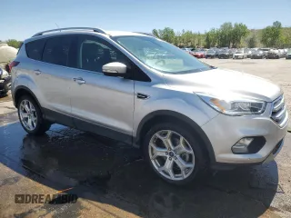 2019 Ford Escape Titanium с VIN 1FMCU9J90KUB85595, выставлен на аукционе Copart как лот 57410045 с пробегом 47 995 миль миль и Списание • Salvage title. История ставок и продаж доступна на DreamBid. Изображение 4.