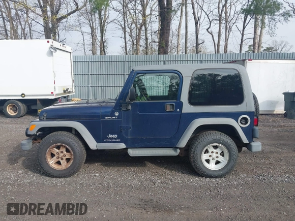 2005 Jeep Wrangler Sport z VIN 1J4FA49S25P302627, wystawiony jako IAAI lot #42100601 z przebiegiem 169 650 mil mil oraz . Historia ofert i sprzedaży dostępna na DreamBid. Obrazek 14.