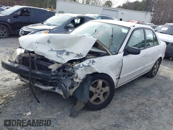 2000 Mazda Protege DX with VIN JM1BJ2221Y0208156, listed as a IAAI auction lot 41609657 with 435,304 mi miles and . Bid and sale history available at DreamBid. Image 2.