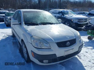 2009 Kia Rio LX with VIN KNADE243196500999, listed as a IAAI auction lot 41582717 with 119,877 mi miles. Bid and sale history available at carsss.com. Image 1.
