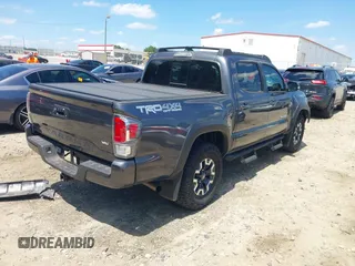 2023 Toyota Tacoma SR with VIN 3TMCZ5AN9PM553246, listed as a IAAI auction lot 42201812 with 20,907 mi miles and . Bid and sale history available at DreamBid. Image 4.