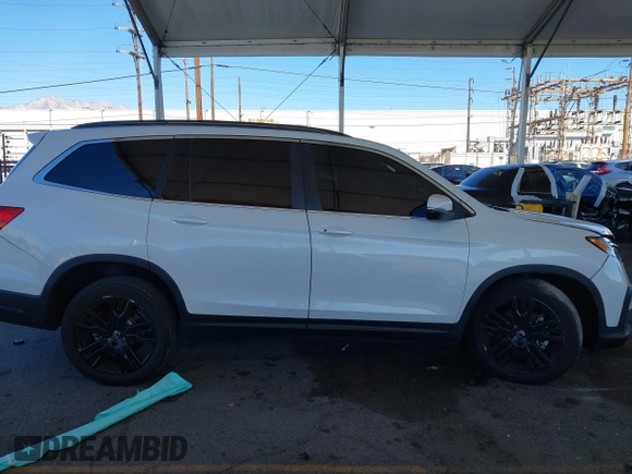 2022 Honda Pilot Special Edition with VIN 5FNYF5H29NB018557, listed as a IAAI auction lot 41402547 with 22,935 mi miles and . Bid and sale history available at carsss.com. Image 13.