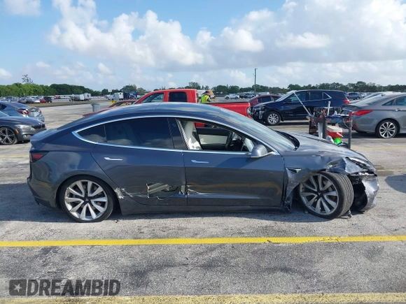 2020 Tesla Model 3 Standard Range Plus with VIN 5YJ3E1EA0LF744046, listed as a IAAI auction lot 41939894 with 102,576 mi miles. Bid and sale history available at carsss.com. Image 13.