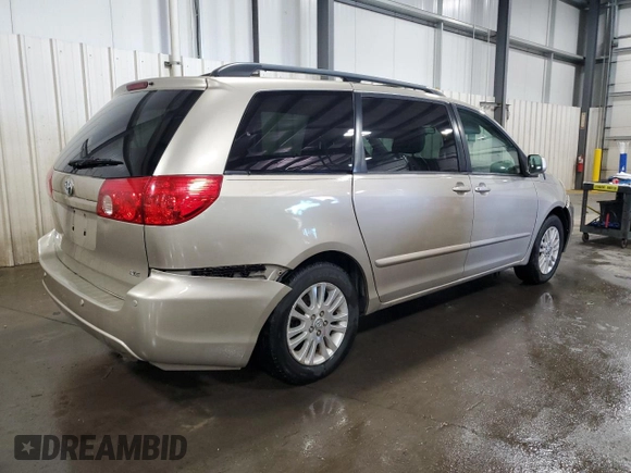 2010 Toyota Sienna XLE with VIN 5TDYK4CC9AS297214, listed as a Copart auction lot 58168805 with 166,970 mi miles and Salvage title. Bid and sale history available at DreamBid. Image 3.