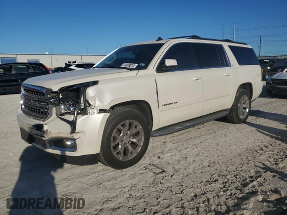 2015 GMC Yukon XL SLT with VIN 1GKS1HKC6FR166415, listed as a Copart auction lot 73029014 with 105,209 mi miles and Salvage Title. Bid and sale history available at carsss.com. Image 1.
