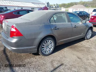 2010 Ford Fusion Hybrid with VIN 3FADP0L30AR376210, listed as a IAAI auction lot 42110727 with 108,897 mi miles. Bid and sale history available at carsss.com. Image 4.