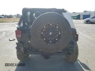 2012 Jeep Wrangler Unlimited Sahara with VIN 1C4BJWEG5CL235835, listed as a Copart auction lot 60673555 with 86,606 mi miles and Salvage title. Bid and sale history available at DreamBid. Image 6.