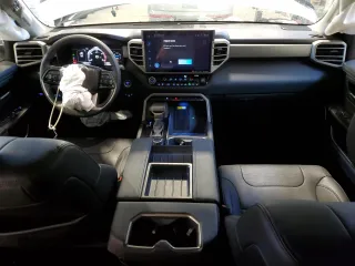 2023 Toyota Tundra Limited Hybrid with VIN 5TFJC5DB5PX015177, listed as a Copart auction lot 87896795 with 77,113 mi miles and Salvage title. Bid and sale history available at DreamBid. Image 8.