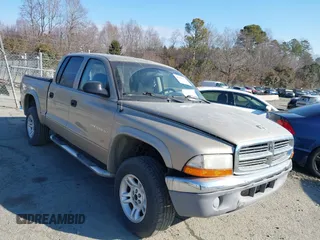 2002 Dodge Dakota z VIN 1B7HG48X92S713297, wystawiony jako IAAI lot #40709139 z przebiegiem 271 904 mil mil oraz . Historia ofert i sprzedaży dostępna na DreamBid. Obrazek 1.