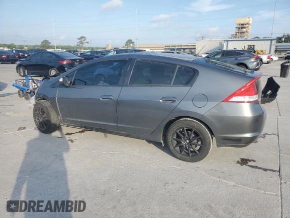 2010 Honda Insight EX with VIN JHMZE2H72AS025427, listed as a Copart auction lot 54983775 with 184,052 mi miles and Salvage Title. Bid and sale history available at DreamBid. Image 2.