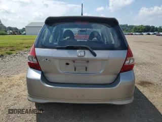 2007 Honda Fit Sport with VIN JHMGD38687S067648, listed as a Copart auction lot 64657345 with 123,055 mi miles and Salvage title. Bid and sale history available at DreamBid. Image 6.