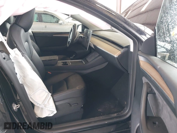 2023 Tesla Model Y Long Range with VIN 7SAYGAEE7PF739924, listed as a IAAI auction lot 41612323 with 75,226 mi miles and . Bid and sale history available at DreamBid. Image 5.