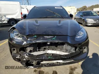 2021 Aston Martin DBX z VIN SCFVUJAWXMTV01292, wystawiony jako Copart lot #83824504 z przebiegiem Nie podano mil oraz Szkody całkowita. Historia ofert i sprzedaży dostępna na DreamBid. Obrazek 5.