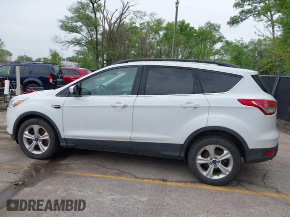 2016 Ford Escape SE with VIN 1FMCU9GX1GUC04085, listed as a IAAI auction lot 42126826 with 130,728 mi miles. Bid and sale history available at carsss.com. Image 14.