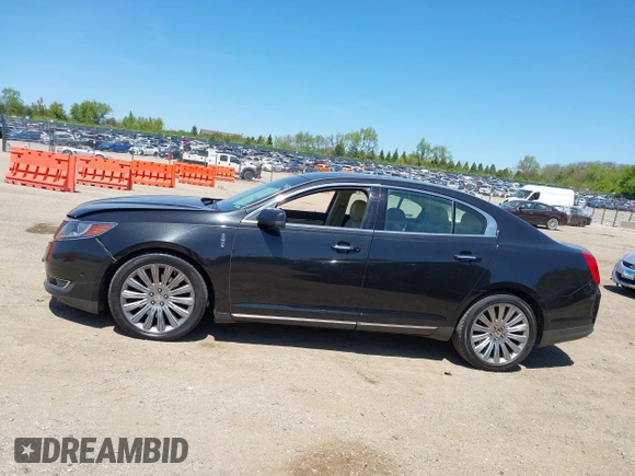 2013 Lincoln MKS z VIN 1LNHL9EK3DG617815, wystawiony jako IAAI lot #42239784 z przebiegiem 122 589 mil mil oraz . Historia ofert i sprzedaży dostępna na DreamBid. Obrazek 14.