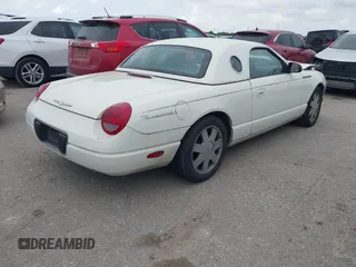 2002 Ford Thunderbird w/Hardtop Premium with VIN 1FAHP60A62Y127579, listed as a IAAI auction lot 42035019 with 98,582 mi miles. Bid and sale history available at carsss.com. Image 4.