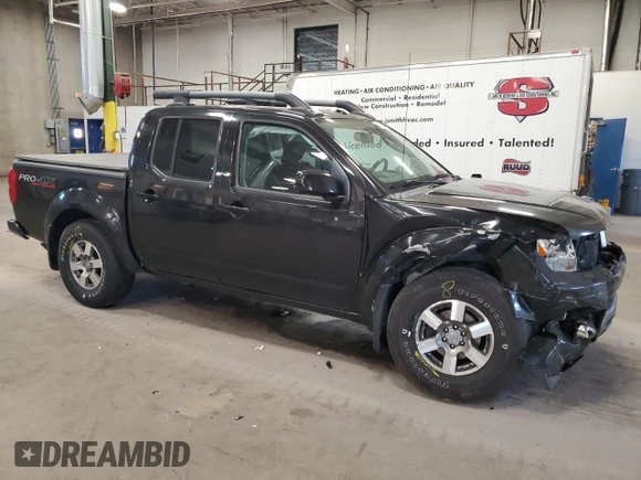 2011 Nissan Frontier Pro-4X with VIN 1N6AD0EVXBC449326, listed as a Copart auction lot 54994455 with 93,841 mi miles and Salvage title. Bid and sale history available at DreamBid. Image 4.